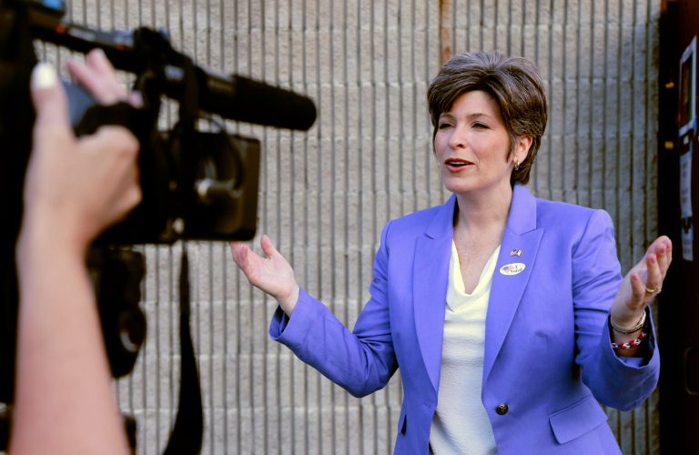 Republican U.S. Senate candidate Joni Ernst talks to a television reporter after casting her vote in Iowa's Republican primary in Red Oak, Iowa, Tuesday. (AP Photo/Nati Harnik)