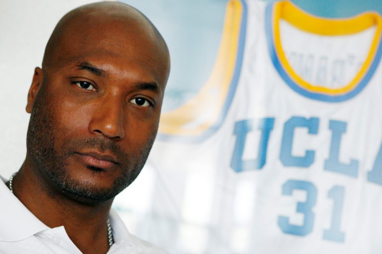 FILE - In this Sept. 18, 2010, file photo, former UCLA basketball player Ed O'Bannon Jr. sits in his office in Henderson, Nev. A $40 million settlement has been completed that will pay college football and basketball players dating to 2003 for the use of their likenesses in NCAA-branded videogames. The payouts could go to more than 100,000 athletes, such as O'Bannon, including some current players, who were either on college rosters or had their images used in videogames made by Electronic Arts featuring college teams. (AP Photo/Isaac Brekken, File)