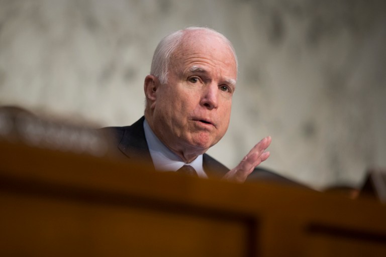 McCain in Afghanistan with Sen. Graham, who warns Obama not to reduce troop levels. (AP Photo/Evan Vucci)