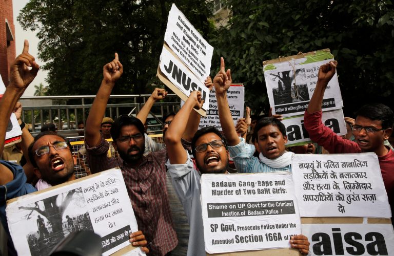 Members of Jawaharlal Nehru University Students Union shout slogans during a protest against a gang rape of two teenage girls in Katra village, outside the Uttar Pradesh state house, in New Delhi, India, on Friday. (AP/Manish Swarup)