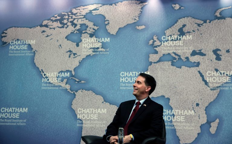 Wisconsin Gov. Scott Walker laughs as he is introduced prior to his speech at Chatham House in central London, Wednesday, Feb. 11, 2015. (AP Photo/Lefteris Pitarakis)