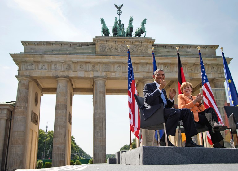 The trip will reunite Obama with Merkel, who doubled as the closest European ally of his presidency, at the Brandenburg Gate. (AP Photo/Evan Vucci)