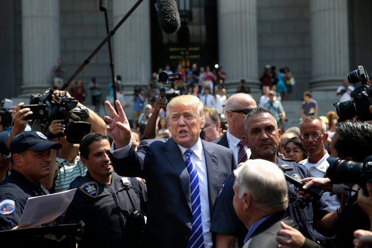 Republican presidential candidate Donald Trump leaves for lunch after being summoned for jury duty in New York, Monday, Aug. 17, 2015. (AP Photo/Seth Wenig)