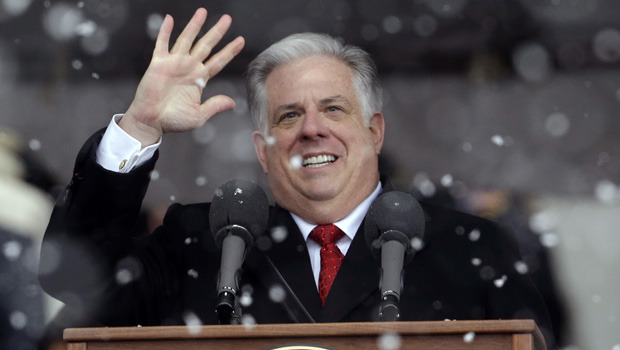 Maryland Gov. Larry Hogan acknowledges supporters as snow falls during inaugural ceremonies at the statehouse in Annapolis, Md. (AP/Patrick Semansky)