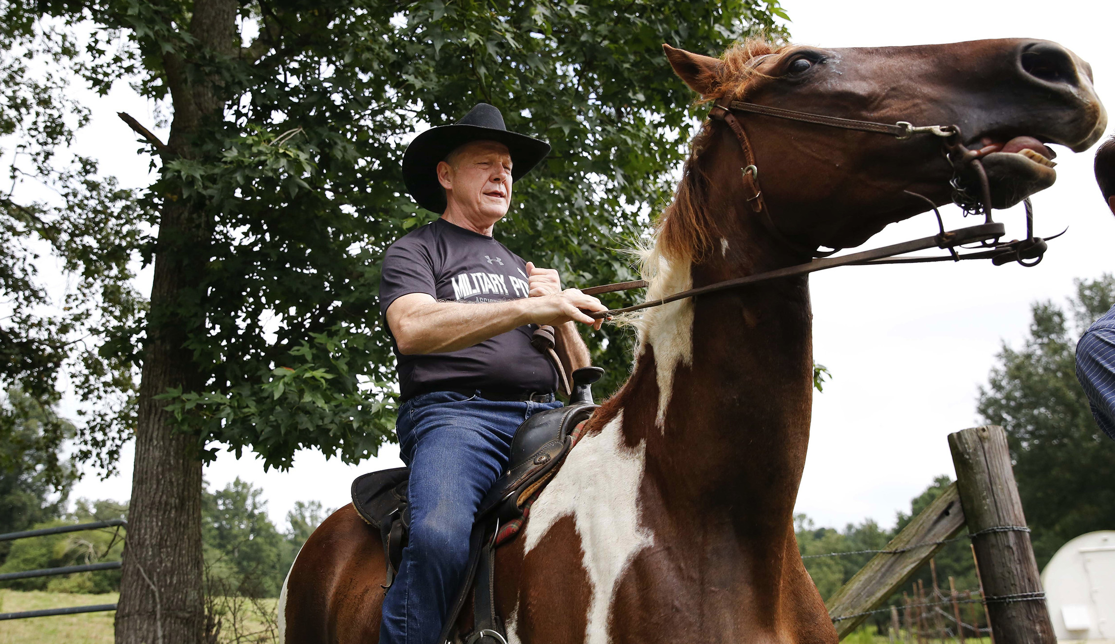 Alabama Senate candidate Roy Moore rides a horse to the polls