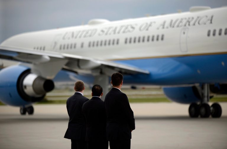 Members of the Secret Service watch as Air Force One taxies on the runway before leaving the Gary/Chicago International Airport in Gary, Ind. (AP Photo/Paul Beaty, File)