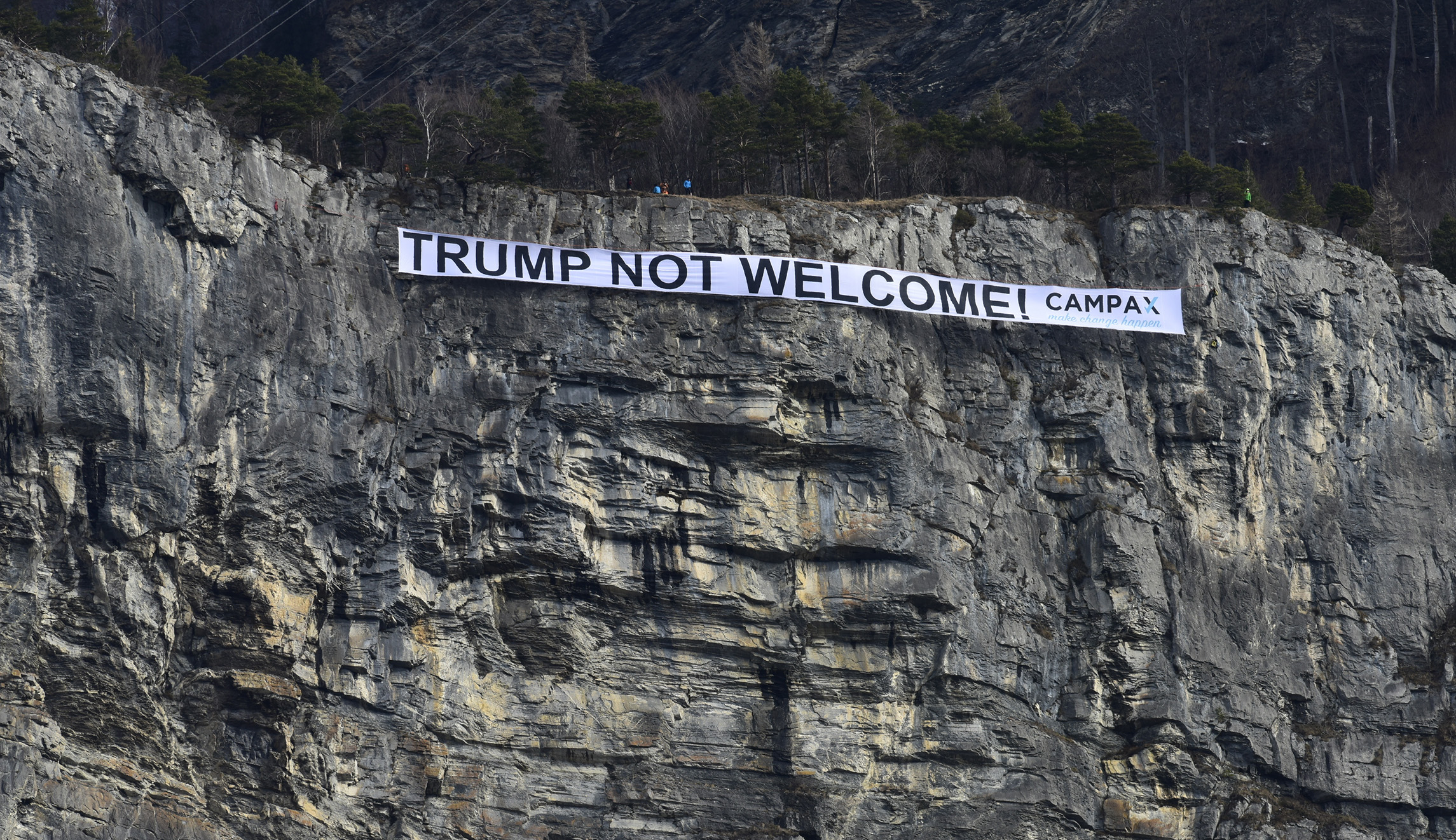 Swiss protesters hang ‘Trump not welcome’ banner at Davos