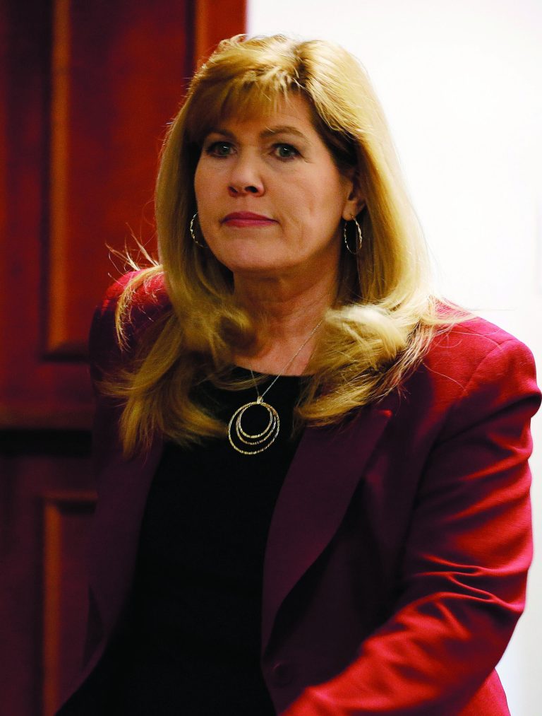 Karen Pearson, the lead prosecutor, arrives for the third day of a preliminary hearing for Aurora theater shooting suspect James Holmes at the courthouse in Centennial, Colo., on Wednesday, Jan. 9, 2013. (AP Photo/Ed Andrieski)