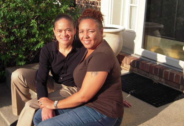 In this Oct. 4, 2012 photo, Irene Huskens, right, and her partner, Leia Burks, sit on the front porch of their home in Bowie, Md. Huskens has the wedding venue picked out: a charming bed-and-breakfast in southern Maryland. But the wedding is no sure thing. Their plans hinge on whether Marylanders make history on Nov. 6, 2012 by voting to legalize same-sex marriage. (AP Photo/David Crary)
