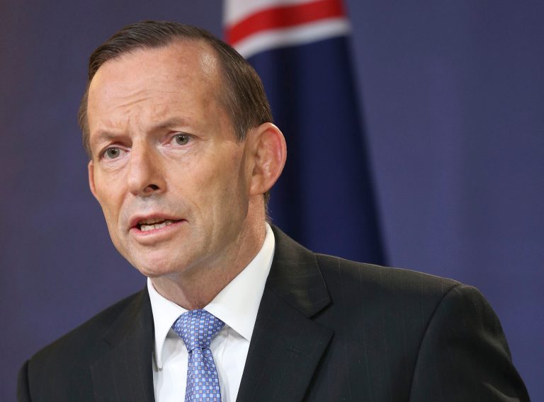 FILE - In this July 19, 2014 file photo, Australia's Prime Minister Tony Abbott speaks during a press conference in Sydney, Australia. Australian police will be sent to the Malaysian airliner's crash site in rebel-held territory in eastern Ukraine as part of a Dutch-led police force to secure the area and help recover victims' remains, Abbott said Sunday, July 27, 2014. (AP Photo/Rob Griffith, File)