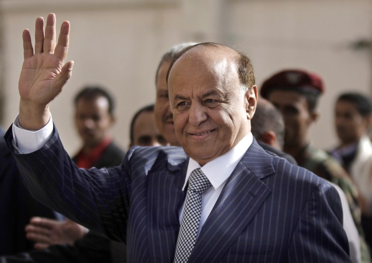   FILE - In this Tuesday, Feb. 21, 2012 file photo,Yemen's Vice President Abed Rabbo Mansour Hadi gestures as he enters a polling center to cast his vote in Sanaa, Yemen. Yemeni troops and armed tribesmen drove al-Qaida militants from two southern strongholds on Tuesday, a major victory in a U.S.-backed offensive to seize territory held for more than a year by the terror network as it exploited political turmoil to gain a foothold in the strategic area. The victories capped weeks of fighting as Yemen's new President Abed Rabbo Mansour Hadi has pledged to uproot al-Qaida from the south with help from the United States as part of a new cooperation following Saleh's ouster. (AP Photo/Hani Mohammed, File)  