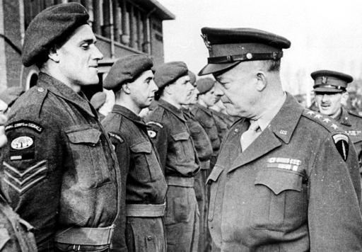 General Dwight Eisenhower, right, supreme Allied commander in the European Theater during World War II, inspects troops of the British Second Army during a visit to their base on the western front, December 7, 1944. (AP Photo/Official British Photo)
