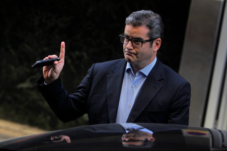 Former Spanish JPMorgan Chase & Co. trader Javier Martin-Artajo greets the press as he leaves the Supreme Court after appearing before a judge for preliminary extradition proceedings, Madrid, Spain, Friday, Nov. 15, 2013. Javier Martin-Artajo is wanted by the United States for allegedly falsifying bank records to cover up $6 billion in trading losses. (AP File)