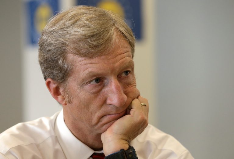 Businessman Tom Steyer listens during a meeting to announce the launch of a group called Virginians for Clean Government at Virginia Commonwealth University in Richmond, Va., Wednesday, Sept. 25, 2013. (AP Photo/Steve Helber)