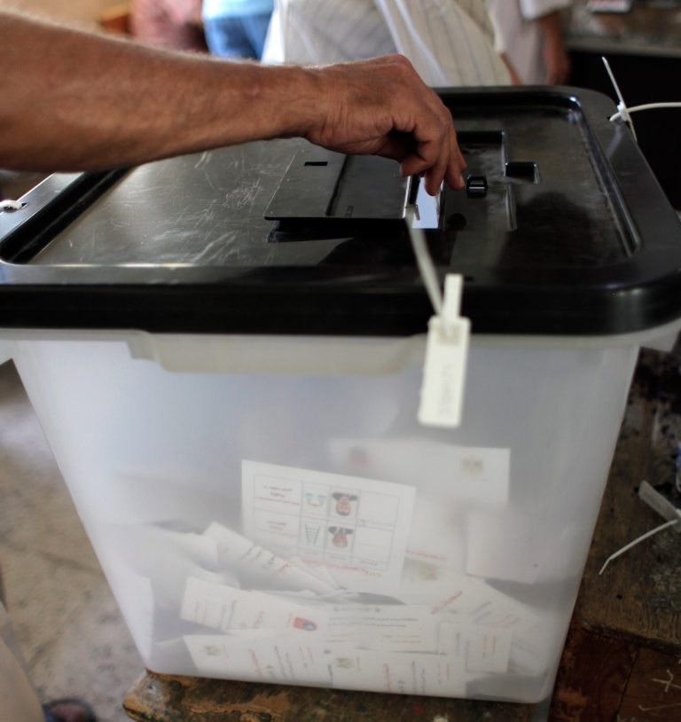  An Egyptian man casts his vote during the first day of the presidential runoff, in Cairo, Egypt Saturday, June 16, 2012. Egyptians voted Saturday in the country's landmark presidential runoff, choosing between Hosni Mubarak's ex-prime minister and an Islamist candidate from the Muslim Brotherhood after a race that has deeply polarized the nation. The two-day balloting will produce Egypt's first president since a popular uprising last year ousted Mubarak, who is now serving a life sentence. (AP Photo/Nasser Nasser)  