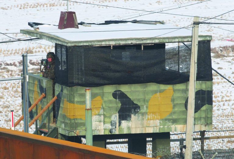 A South Korean army soldier stands guard at a military post at Imjingak Pavilion near the border village of Panmunjom, in Paju, South Korea, Thursday, Dec. 13, 2012. North Korea successfully fired a long-range rocket on Wednesday, defying international warnings as the regime of Kim Jong Un took a big step forward in its quest to develop a nuclear missile. (AP Photo/Ahn Young-joon)