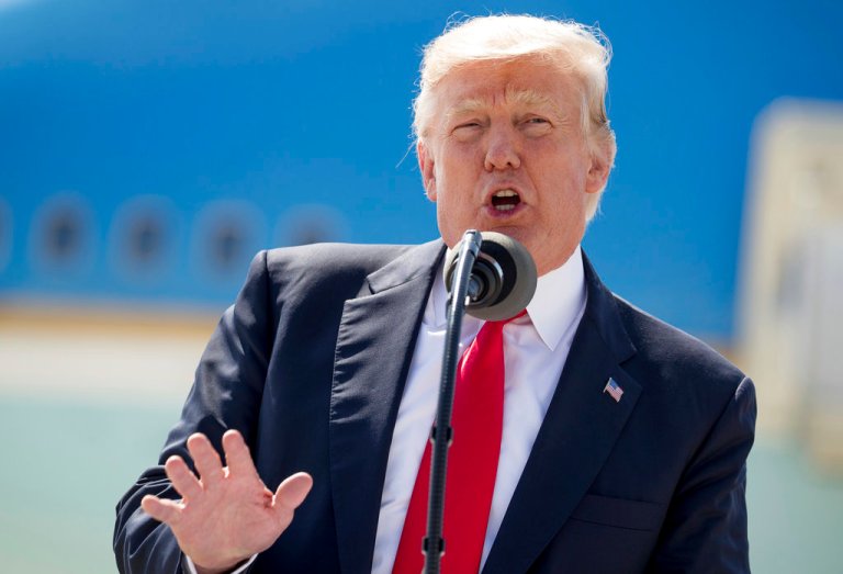 FILE - In this June 13, 2017, photo, President Donald Trump speaks in front of Air Force One in Milwaukee, Wis. Trump is outlining the financial health of the business assets he placed into a trust when he took office. The information comes in a new financial disclosure he voluntarily made June 16, to the Office of Government Ethics. The documents cover January 2016 through this spring. (AP Photo/Andrew Harnik)