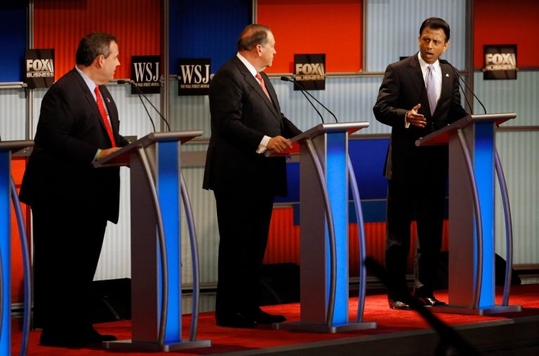 After Gov. Bobby Jindal, right, leveled attacks on virtually the entire GOP field for not cutting government, Gov. Chris Christie, left, batted his claims away and trained his fire on Hillary Clinton -- who he said is 
