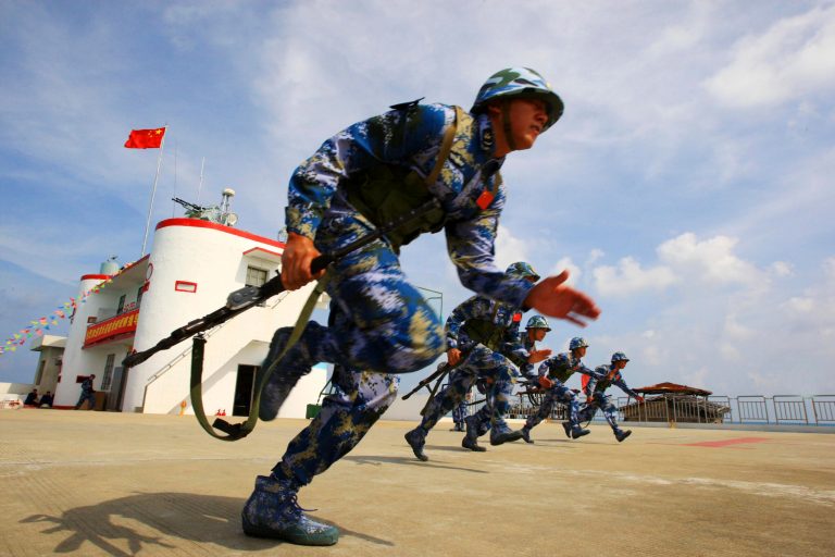 In this April 8, 2010 photo released by China's Xinhua news agency on Friday April 23, 2010, Chinese marines take train on the Chigua Skerry of the Spratly Islands. (AP Photo/Xinhua, Zha Chunming)