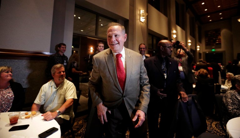 Former Alabama Chief Justice and U.S. Senate candidate Roy Moore, greets supporters before his election party, Tuesday, Sept. 26, 2017, in Montgomery, Ala. (AP Photo/Brynn Anderson)