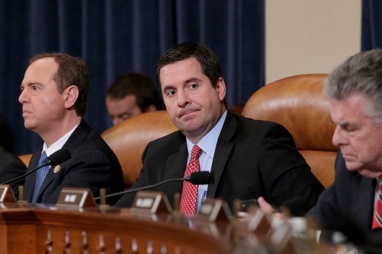 House Intelligence Committee Chairman Rep. Devin Nunes, R-Calif., center, flanked by the committee's ranking member Rep. Adam Schiff, D-Calif., left, and Rep. Peter King, R-N.Y., listens on Capitol Hill in Washington, Monday, March 20, 2017, during the committee's hearing on allegations of Russian interference in the 2016 U.S. presidential election. (AP Photo/J. Scott Applewhite)