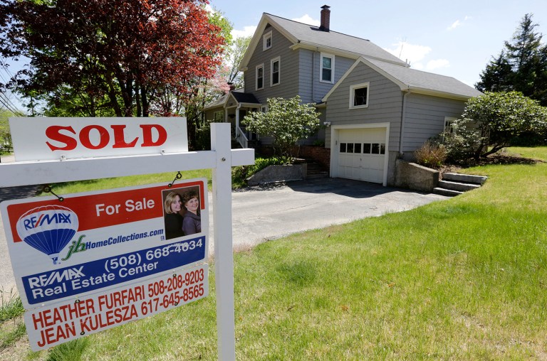 Fannie Mae and Freddie Mac will back home loans up to $636,150 in high-cost areas next year. (AP Photo/Steven Senne, File)
