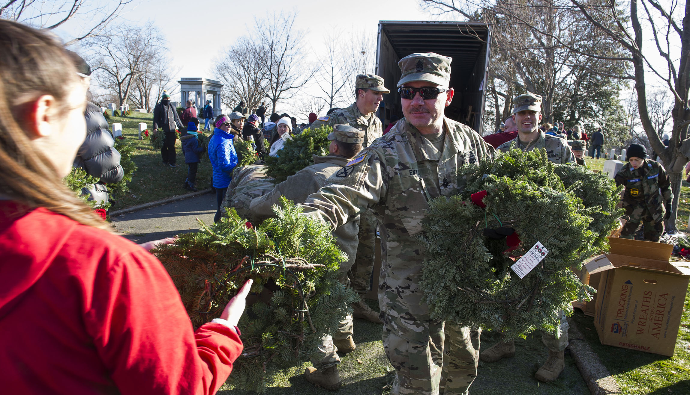 Tens of thousands volunteer to place wreaths across Arlington National Cemetery