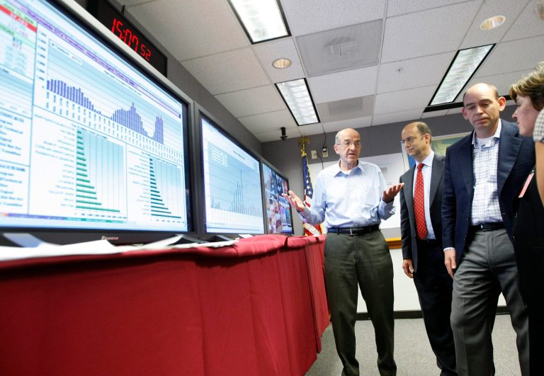 Former acting chairman of the Federal Communications Commission Michael J. Copps, left, visits the digital TV transition command center at FCC headquarters in Washington in June 2009. (AP Photo/Gerald Herbert)