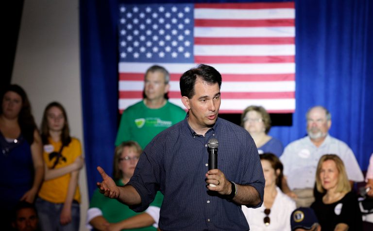 Walker acknowledged that in the past he had expressed support for a pathway to citizenship for illegal immigrants, but said that he wasn't talking about amnesty at the time. (AP Photo/Charlie Neibergall)