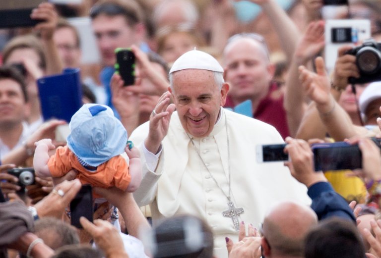 Pope Francis waves to the faithful as he arrives for his weekly general audience, in St. Peter's Square, at the Vatican, Wednesday, June 24, 2015. (AP Photo/Riccardo De Luca)