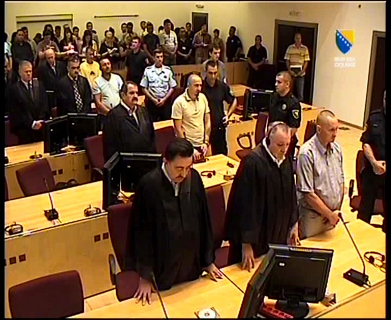   Image made from TV provided by Bosnian war crimes court showing former Bosnian Serb soldiers Franc Kos, first row right, Stanko Kojic second row center, Vlastimir Golijan third row center, and Zoran Goronja, forth row right, during the pronouncement of the verdict for the four Bosnian Serb soldiers in Sarajevo, Bosnia, on Friday, June 15, 2012. Bosnian court on Friday convicted the four former elite soldiers of crimes against humanity for their part in the 1995 Srebrenica massacre and handed down sentences of up to 43-years. Bosnian Serb Stanko Kojic was sentenced to 43 years in prison; Slovenian Franc Kos and Bosnian Serb Zoran Goronja both got 40 years; and Vlastimir Golijan received a 19-year prison sentence.(AP Photo/Bosnian war crimes court)  