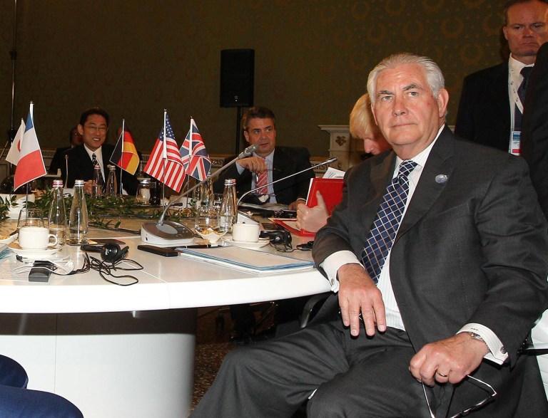 Secretary of State Rex Tillerson sits at the table during a meeting of foreign ministers of the G-7 Summit in Lucca, Italy, Tuesday, April 11, 2017. (Riccardo Dalle Luche/ANSA via AP)