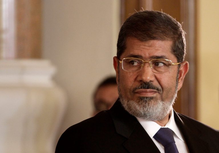 FILE - In this Friday, July 13, 2012 file photo, Egyptian President Mohammed Morsi holds a joint news conference with Tunisian President Moncef Marzouki, unseen, at the Presidential palace in Cairo, Egypt. An Egyptian appeals court on Wednesday, March 27, 2013 annulled a presidential decree appointing the top prosecutor in a new challenge by the judiciary to Islamist President Mohammed Morsi that throws the country's legal system into confusion. The dispute is rooted in a series of controversial decrees Morsi issued in November that sparked widespread protests. In them, he decreed that the prosecutor general could serve in office for only four years, with immediate effect on the post's holder at the time Abdel-Meguid Mahmoud, in place since 2006. (AP Photo/Maya Alleruzzo, File)