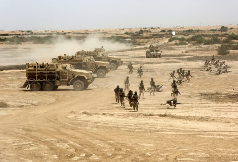 Iraqi, U.S. and Spanish soldiers participate in a training mission outside Baghdad, Iraq, Wednesday, May 27, 2015. (AP Photo/Khalid Mohammed)