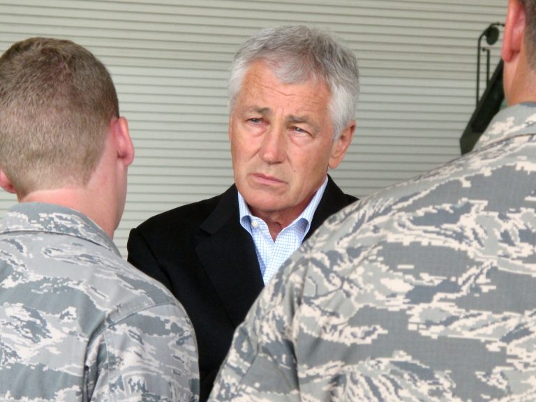 Secretary of Defense Chuck Hagel chats with Air Force personnel Wednesday, July 17, at Joint Base Charleston near Charleston, S.C. (AP/Bruce Smith)