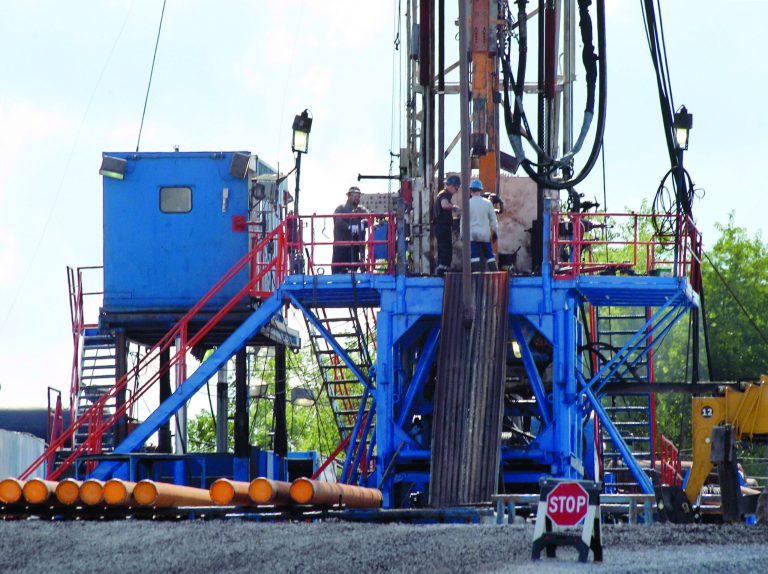 FILE - In this June 25, 2012 file photo, a crew works on a gas drilling rig at a well site for shale based natural gas in Zelienople, Pa. It sounds like a free-market success story: a new gas drilling boom driven by hydraulic fracturing, or fracking, which delivers a vast new source of cheap energy without the government subsidies that solar and wind power demand. But men who helped pioneer fracking recall a different story. From the shale fields of Texas and Wyoming to the Marcellus in the northeast, the U.S. Department of Energy contributed more than $100 million in direct federal research to help develop fracking, and Congress added $10 billion in tax breaks. Now, some of the biggest supporters of shale gas say the government should continue to back renewable energy research - for decades, if need be - to deliver future breakthroughs in that field. (AP Photo/Keith Srakocic)