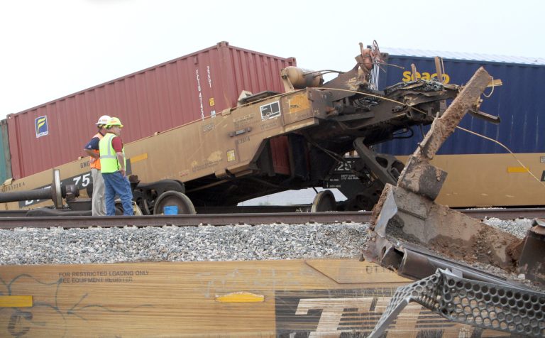 Crews work to remove 39 cars of a 179-car Union Pacific train that derailed approximately four miles south of Picacho, Arizona late September 15, 2014. According to Zoe Gisela Richmond, Director of Public Affairs for Union Pacific, an intense local thunderstorm with high winds may have played a part in the accident. (AP Photo/Casa Grande Dispatch, Steven King)