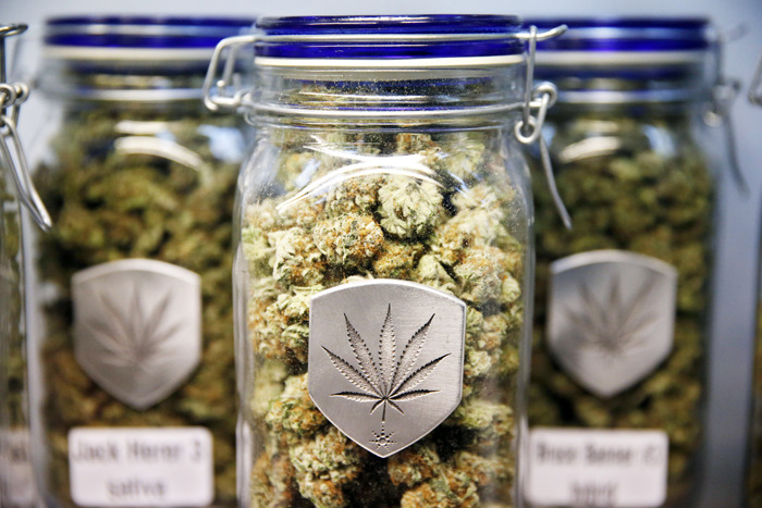 Different strains of pot are displayed for sale at Medicine Man marijuana dispensary in Denver. (AP Photo/Brennan Linsley, File)