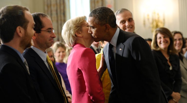 Sen. Elizabeth Warren, D-Mass., left, gets a kiss from President Barack Obama following a statement with Richard Cordray, the new director of the Consumer Financial Protection Bureau. (AP Photo/Susan Walsh)