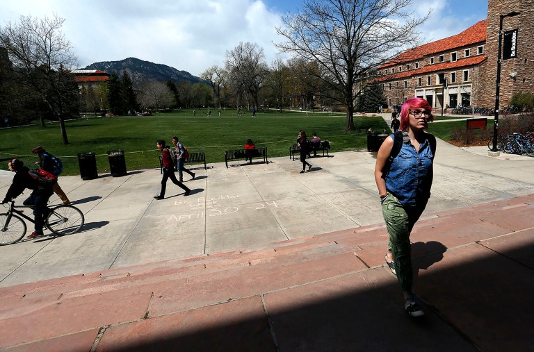 Students walk to and from classes on the campus quad of the University of Colorado, in Boulder, Colo., Monday April 20, 2015. (AP Photo)Â 