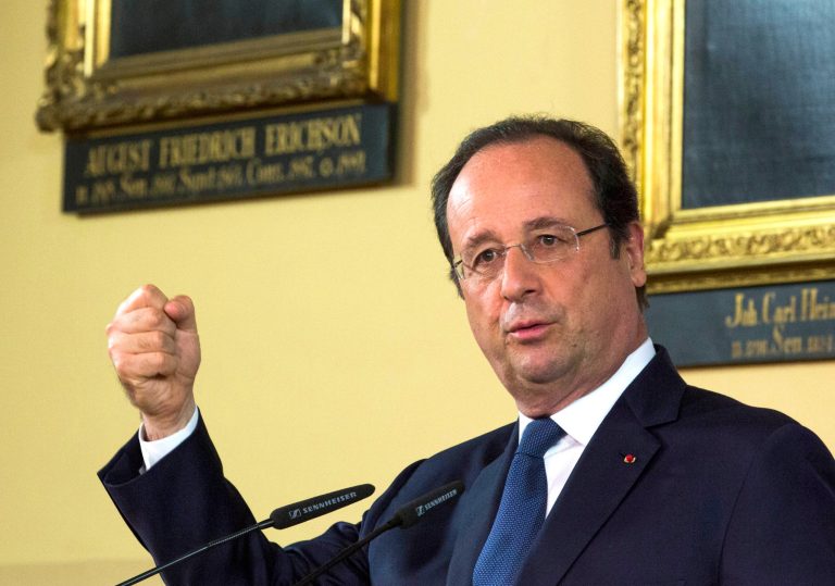 French President Francois Hollande gestures during a news conference with German Chancellor Merkel at the town hall in Stralsund, northern Germany, Saturday, May 10, 2014 during the second day of Hollande's two days visit to Merkel's scenic home constituency on the Baltic coast . One of the main talking points is expected to be over whether the European Union should impose further sanctions on Russia, for its involvement in the Ukraine crisis. (AP Photo/Gero Breloer)