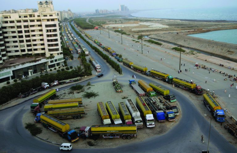 Oil tankers, which were used to transport NATO fuel supplies to Afghanistan, are parked, in Karachi, Pakistan, Monday, July 2, 2012. (AP Photo/Shakil Adil)
