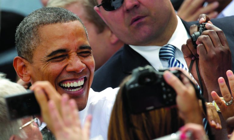 President Barack Obama greets the crowd during a campaign stop at the Living History Farms Saturday, Sept. 1, 2012, in Des Moines, Iowa. (AP Photo/Charlie Riedel)