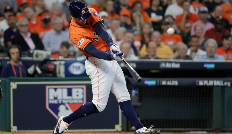 Boston Red Sox and Houston Astros fans stood for the national anthem. They sang. Et cetera. Pretty standard stuff. (AP Photo/David J. Phillip)