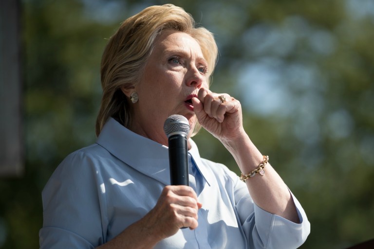 Democratic presidential candidate Hillary Clinton stops her speech to cough at the 11th Congressional District Labor Day festival at Luke Easter Park in Cleveland, Ohio, Monday, Sept. 5, 2016. (AP Photo/Andrew Harnik)