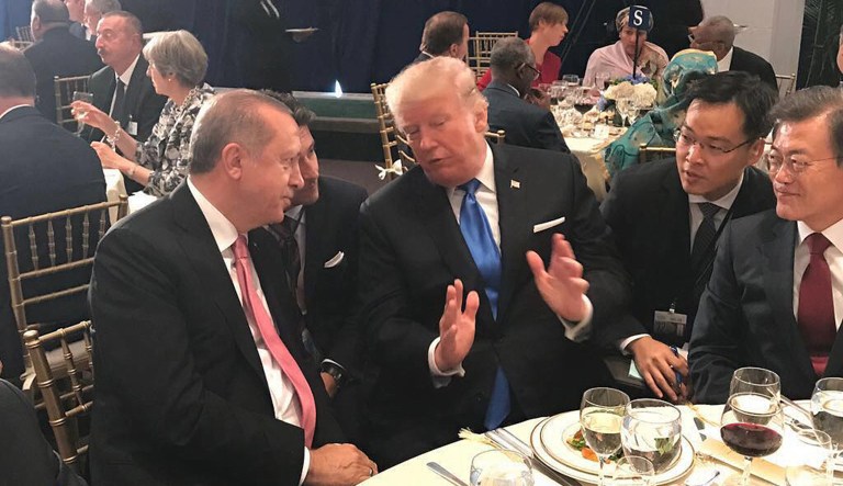 Turkey's President Recep Tayyip Erdogan, left, listens to U.S. President Donald Trump during a dinner at the U.N. headquarters Tuesday, Sept. 19, 2017. (Presidency Press Service, Pool Photo via AP)