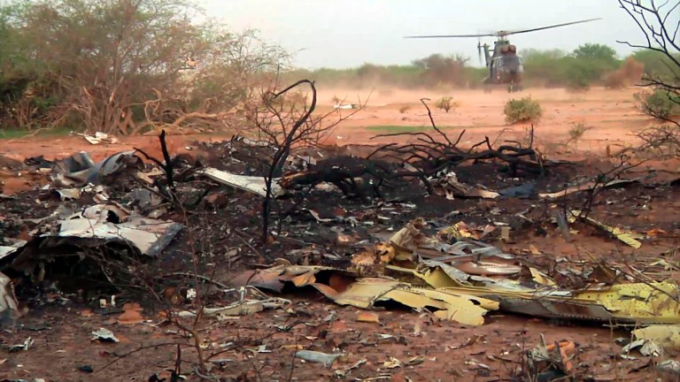 This photo provided Friday July 25, 2014 by the French army shows a helicopter at the site of the plane crash in Mali. French soldiers secured a black box from the Air Algerie wreckage site in a desolate region of restive northern Mali on Friday, the French president said. Terrorism hasn't been ruled out as a cause, although officials say the most likely reason for the catastrophe that killed all onboard is bad weather. At least 116 people were killed in Thursday's disaster, nearly half of whom were French. (AP Photo/ECPAD)