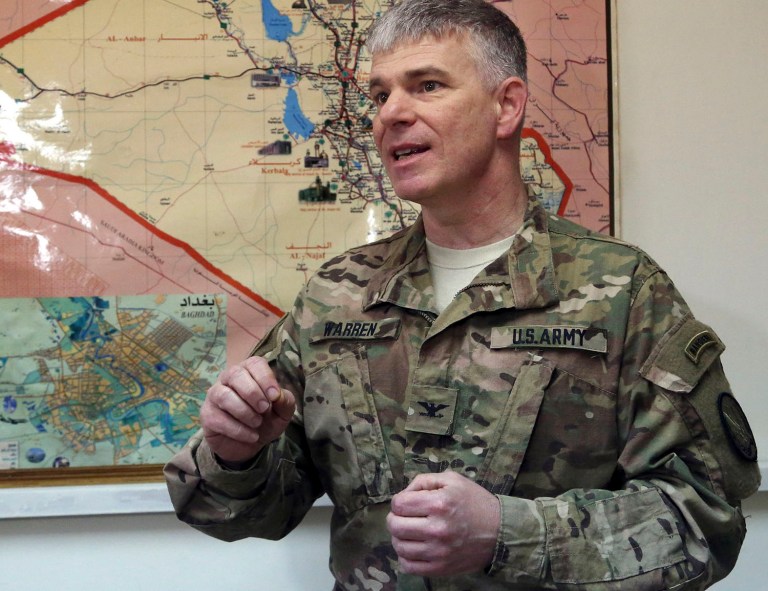 A former boxer, Col. Steve Warren enjoys sparring with reporters, pounding at them with facts and peppering his commentary with quick verbal jabs. (AP Photo/Khalid Mohammed, File)