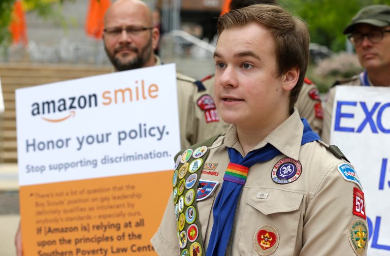 Pascal Tessier, 17, a gay Eagle Scout from Kensington, Md., speaks in front of a group of Boy Scouts and scout leaders, Wednesday, May 21, 2014, outside the headquarters of Amazon.com in Seattle. The group delivered a petition to Amazon that was started as an online effort by Tessier and gathered more than 125,000 signatures, urging Amazon to stop donating money to the Boy Scouts due to the organization's policy of excluding openly gay adults from leadership positions, despite recently accepting gay youth as scouts. (AP Photo/Ted S. Warren)