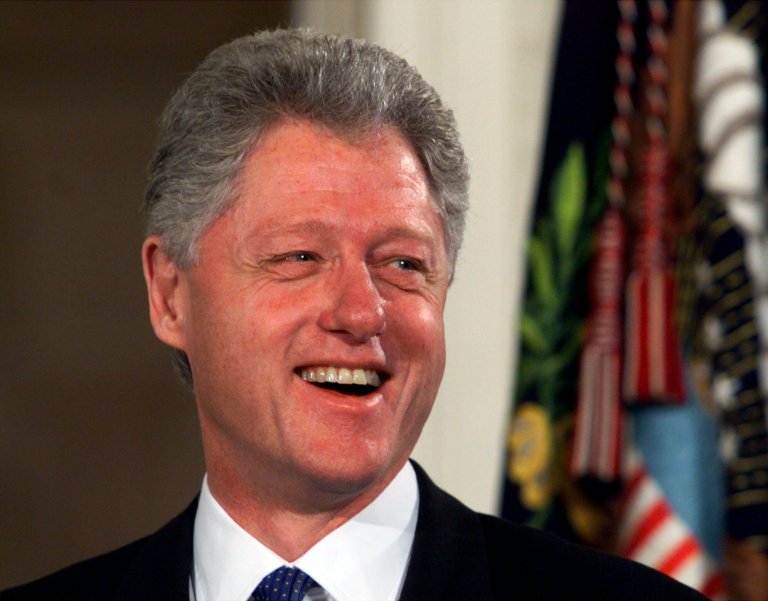 President Clinton smiles as he arrives at an event in the East Room of the White House on Feb. 1,1999. (AP Photo/Ron Edmonds)